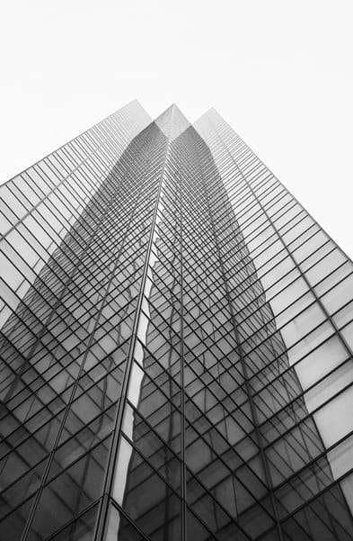 Glass office tower rising into the sky
